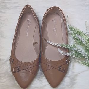 Charles Albert caramel colored pointy toed flats.